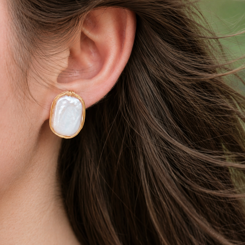 Odette wirework freshwater pearl earrings worn in close-up