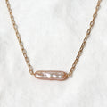 Rosalie Necklace with an elongated blush-pink baroque pearl set horizontally on a 14k gold-filled chain